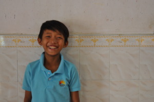 A boy smiling with hope