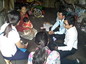 Our staff with Government officers visit families