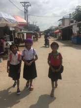The girls are walking to school.