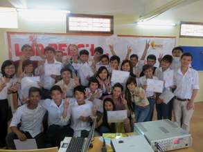 Fresh grads and volunteers pose for a group photo