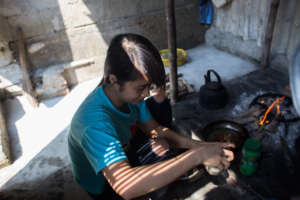 Thuyet prepares meal at home