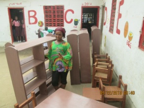 Deki's proprietor helps prepare the reading room
