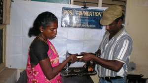 Mrs.Rakkammal receives Sewing Machine as free