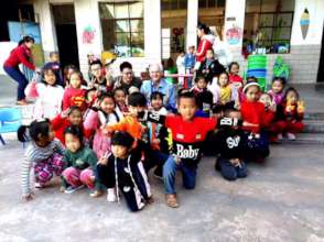 Volunteer Cardiologist Julio and School Children