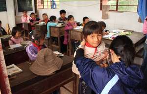 A volunteer checking for murmurs