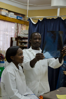 ECP's Jovita and JB reviewing an x-ray
