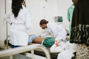 Teddy & Glorious treating a patient in the ED