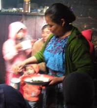 Candelaria making the herbal extract.