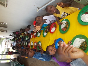Pauline supervises kitchen &kids enjoy the results