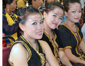 Young Dusun girls in traditional costumes