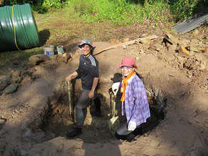Japanese students dig hole for septic tank