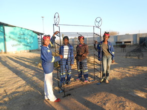 Our girls with the finished shoe rack