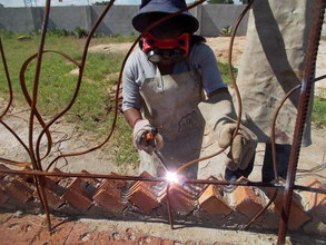 Multi-talented Lindiwe welding our railing
