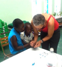 Sithabisiwe assists Doctor with testing little one