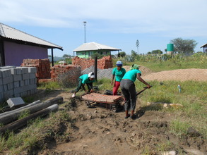 Our Senior Girls muscle bricks to our greenhouse
