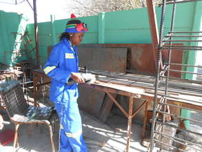 Thamani is preparing parts for a client order.