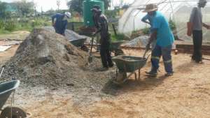 Nkosi and the crew preparing the concrete flooring