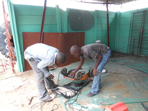 Denver & Anele fix lawnmower for client