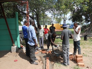 Collen teaches bricklaying 101!