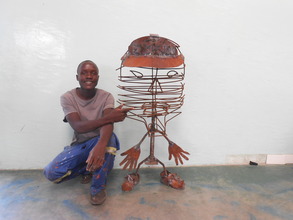 Nkosi with his sculpture