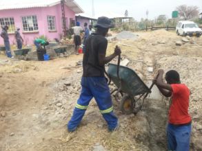 It takes a crew to hand mix cement, gravel & sand!