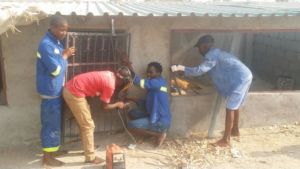 Welding the door to the coop