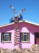 Ngqabutho (left) with zipper on sewing building