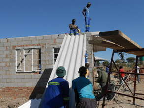 It takes team effort to put on a roof