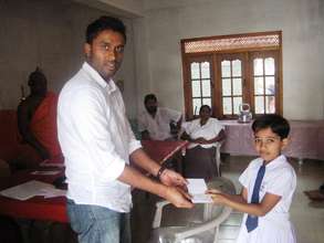 Educate Lanka Student reciving her Scholarship