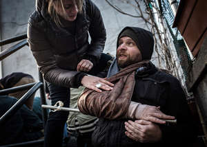 Andrea Bruce puts a splint on Michel Huneault