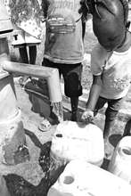 Kids receiving water for the first time