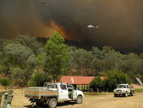Fire fighting crews and water bombing chopper