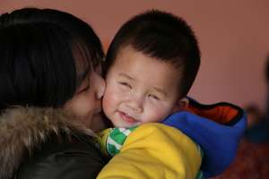 Qiu Ye (Luke) gets a cuddle from his Bethel mama