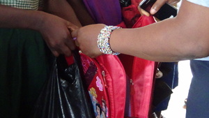 pupil recieving school bag