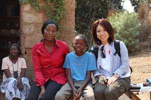 One of our beneficiaries and a staff of AAR Japan