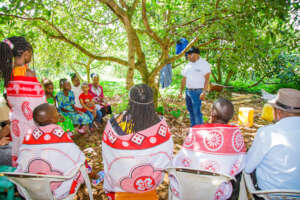 A sports for change supporter addressing guests