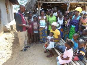 Counseling: talking to families in Totota.