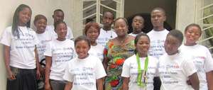Adolescents Club members posing with Madam Pauline