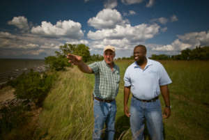 NRCS staff with Maryland farmer. USDA NRCS photo.
