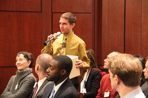 An audience member asks a question of our panel.