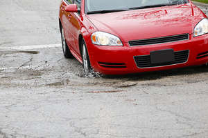 Pothole-ridden roads (CC courtesy State Farm)