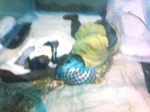 A benificiary sleeping with her baby