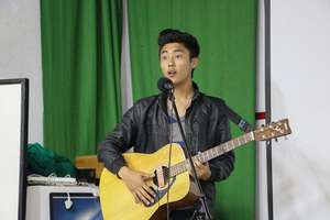 Young and talented singer during Open Mic Night