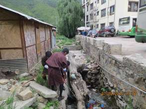 Trying to remove a log from a drain- Before