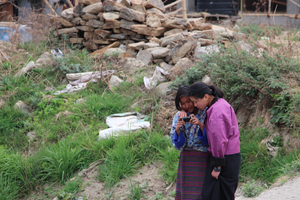 Girls work on their photostories during a workshop