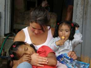 BWAB Costa Rica volunteer Cata Mora embraces girl