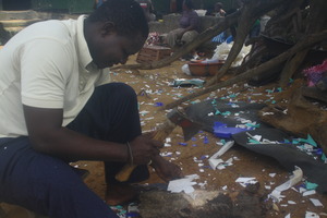 Worker Abraham Ivy breaks down plastic scraps.