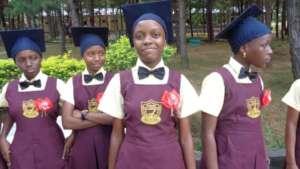Evelyne and fellow graduates