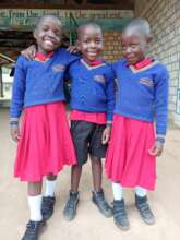 Aaron (middle) with friends Sarah and Neema