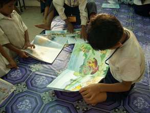 Kids reading at PIO Library